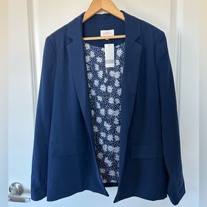 Navy blue blazer with floral inside.